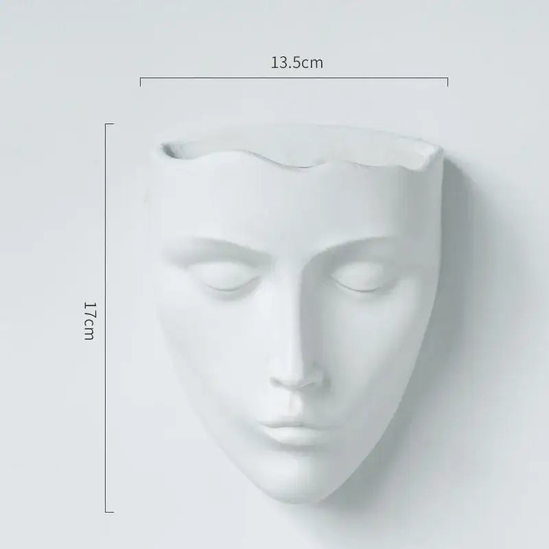 Modern gold face decorbites ceramic wall-mounted vase featuring a minimalist white ceramic closed-eyed face planter