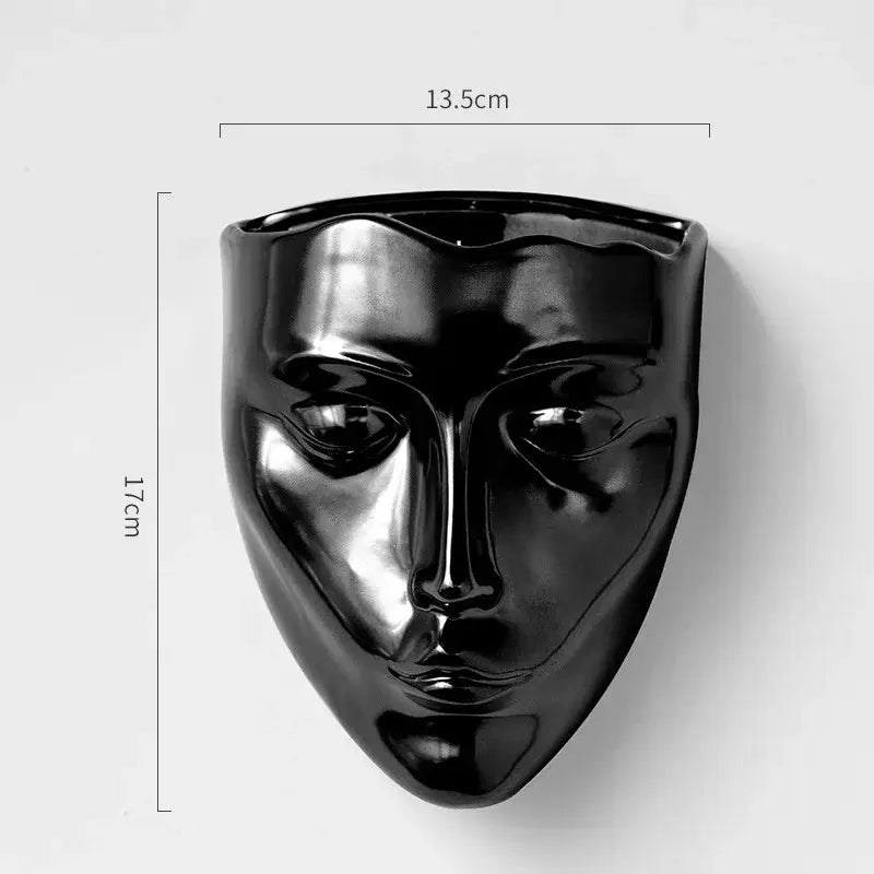 Black glossy decorbites ceramic wall-mounted face sculpture with smooth contours, ideal as a ceramic wall-mounted vase decor