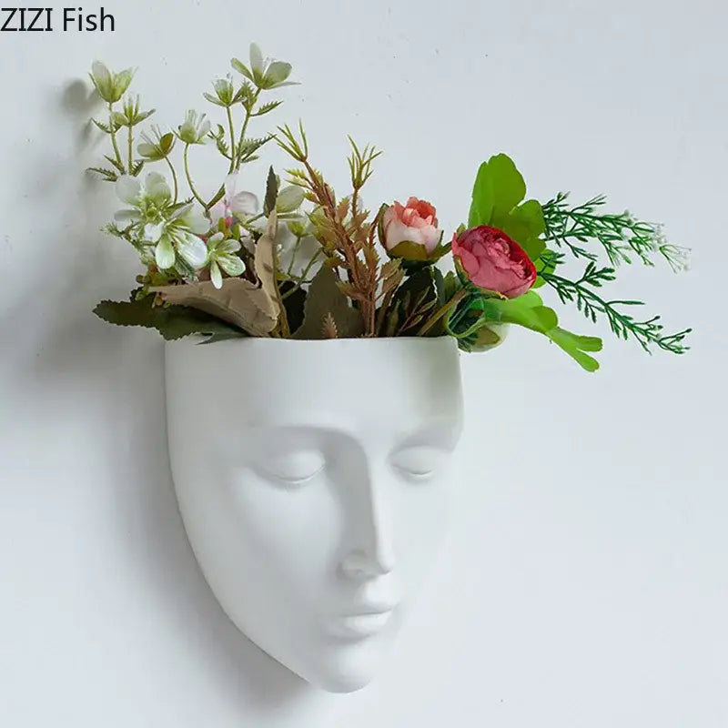 Modern gold face decorbites ceramic wall-mounted vase in white holding soft pink white artificial flowers with green foliage