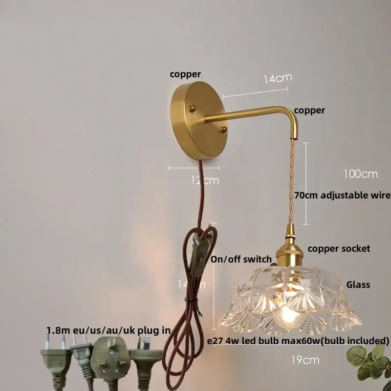 Modern gold wall lamp featuring clear faceted glass shade and adjustable wire for bedroom wall light illumination