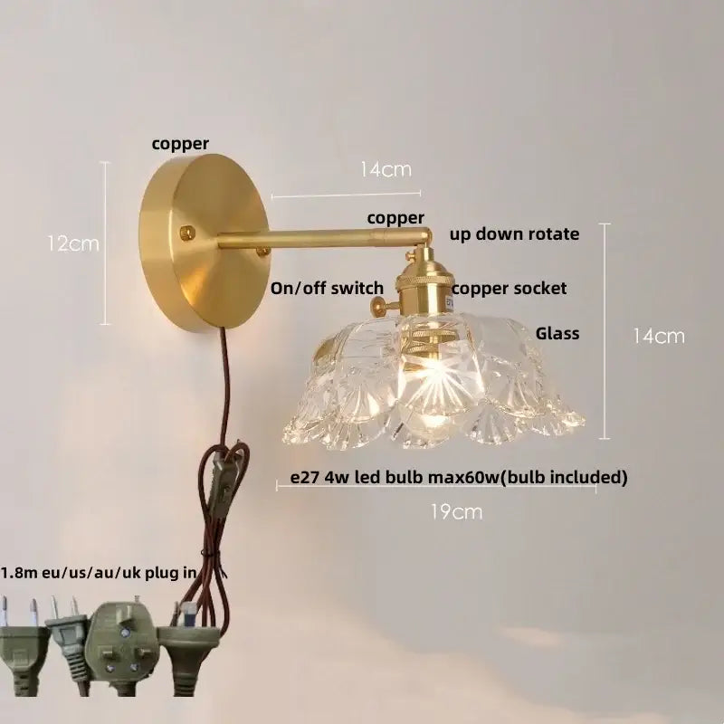 A vintage-style wall lamp with brass copper finish and clear faceted glass shade for bedroom wall light