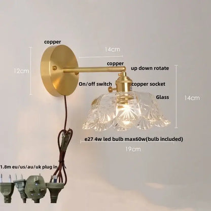 A vintage-style wall lamp with brass copper finish and clear faceted glass shade for bedroom wall light