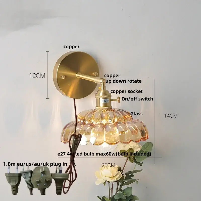 Modern gold brass-finished wall light with faceted clear glass amber shade and adjustable arm by decorbites clear glass