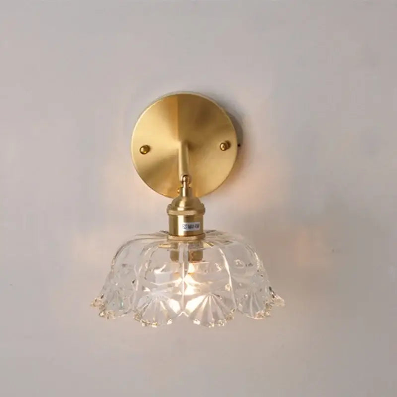 Modern gold faceted clear glass wall light with brass mounting plate and stem for bedroom decorbites clear glass sconce