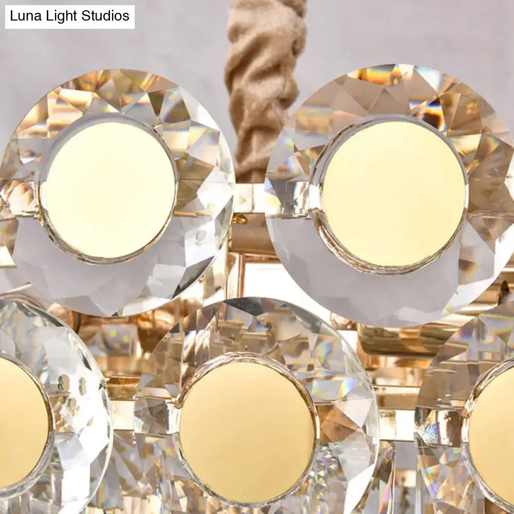 Gold-toned DecorBites™ 12-head light fixture with faceted crystal oval glass shades and warm LED bulbs in postmodern design
