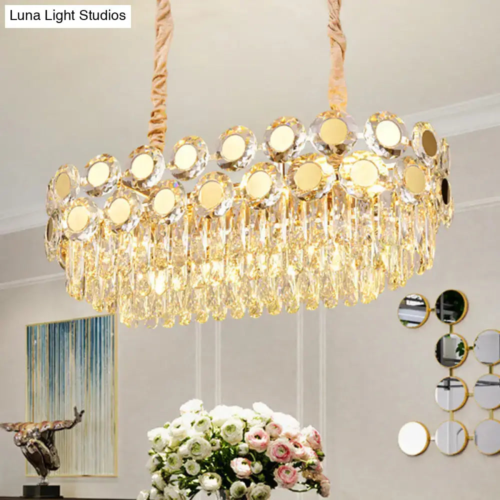 Gold-toned DecorBites 12-head suspension light fixture with faceted crystal droplets and circular mirrored accents