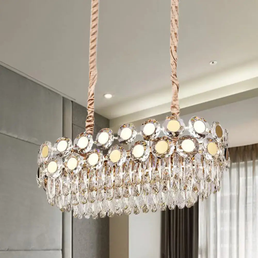 Decorbites 12-head gold suspension light fixture with oval faceted crystal droplets and mirrored discs reflecting warm light