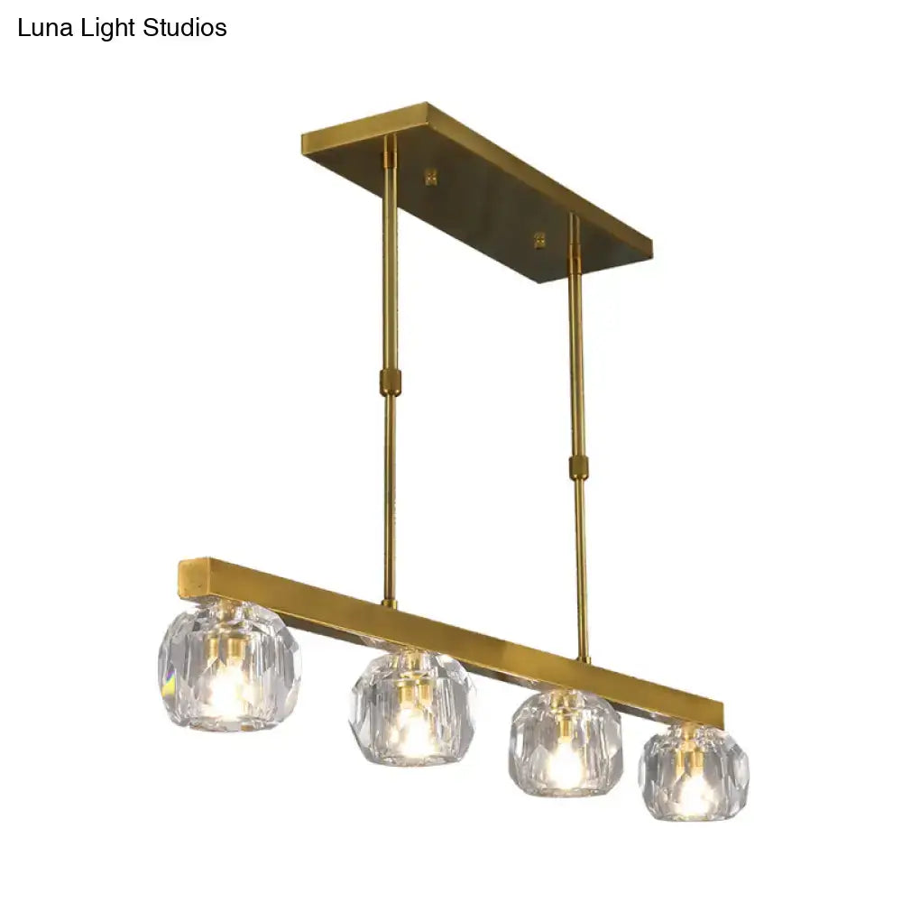 Modern gold faceted crystal island pendant light with brass finish and four faceted crystal sphere shades for kitchen dining room