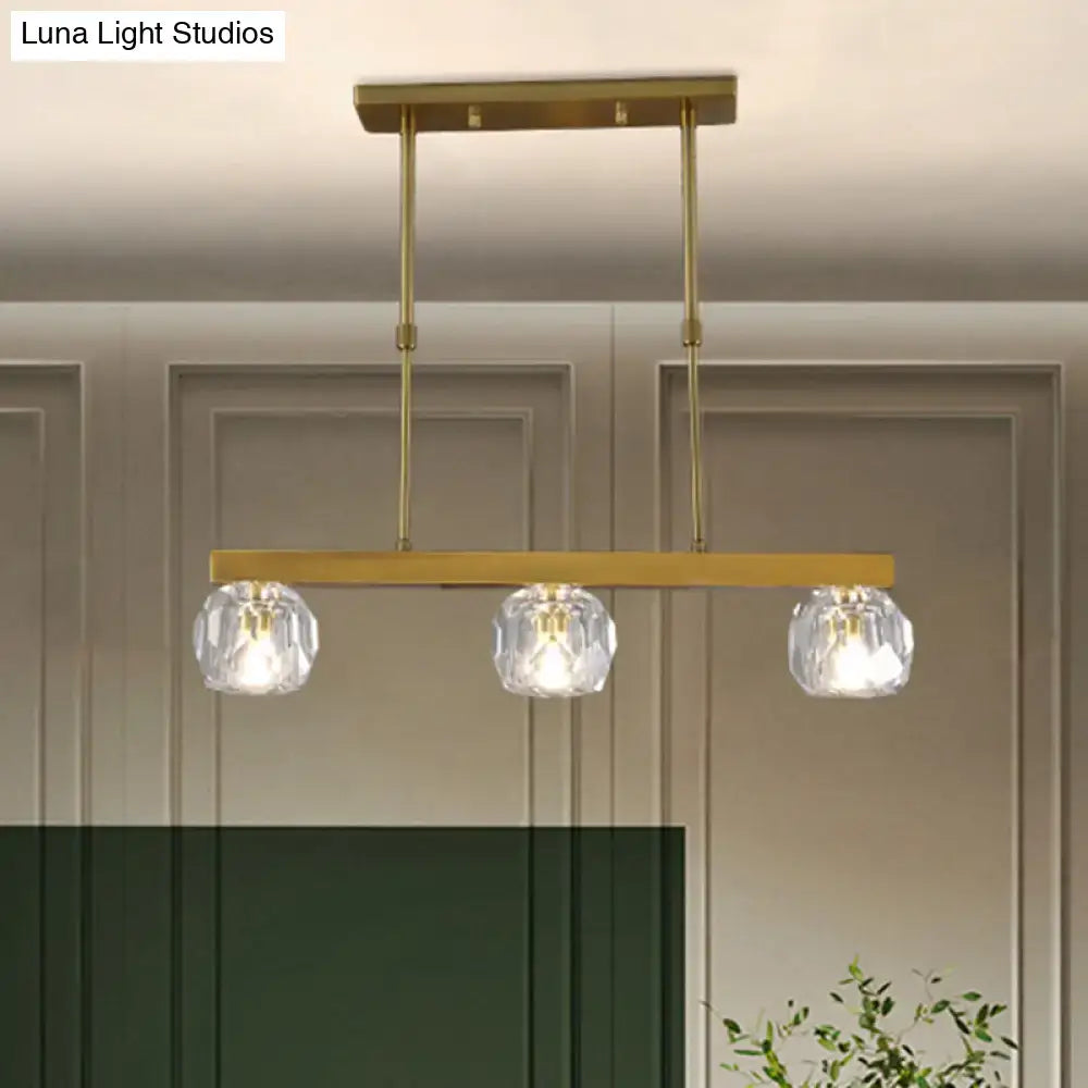 Modern gold faceted crystal island pendant light with three faceted crystal sphere globe shades for kitchen or dining room