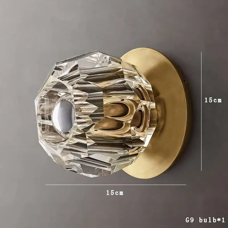 Modern gold faceted crystal wall lamp featuring a decorbites crystal doorknob with brass base and luxury geometric cuts