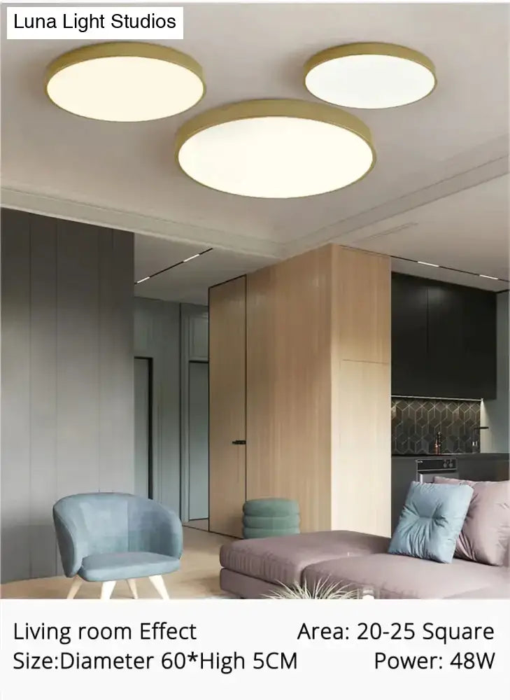 Three DecorBites™ modern ceiling lights with gold rims and white diffused panels for living room and bedroom use