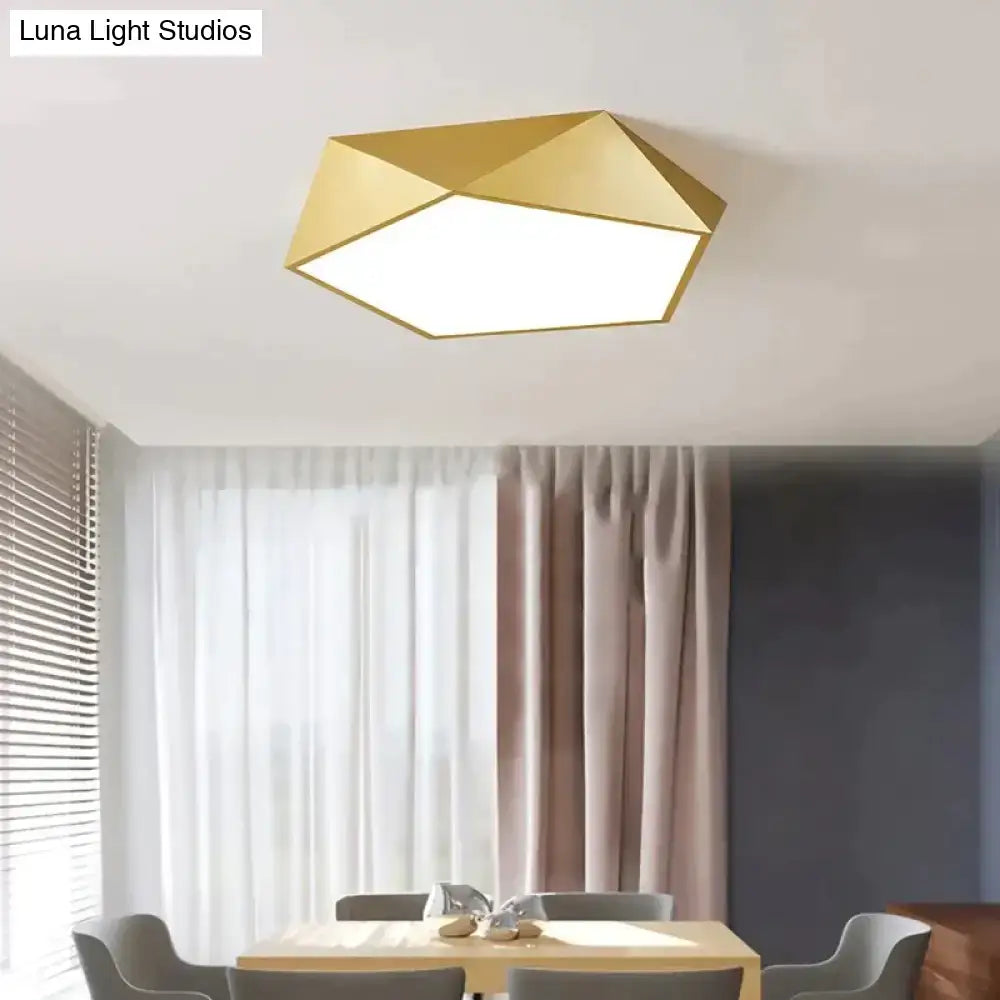 Gold geometric ceiling light with modern faceted design and metallic finish for indoor living room or bedroom use