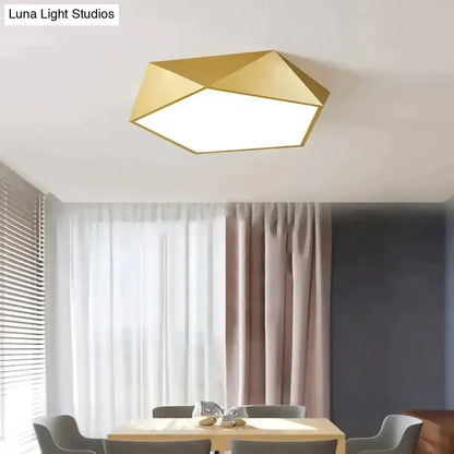 Gold geometric ceiling light with modern faceted design and metallic finish for indoor living room or bedroom use