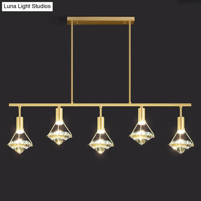 Modern gold finish light fixture with five diamond-shaped crystal shades for kitchen island lighting