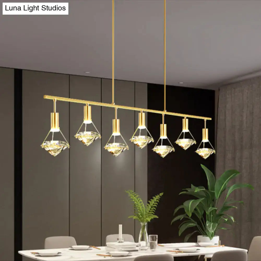 Modern gold finish light fixture with diamond-shaped pendant lights and clear crystal accents for kitchen island