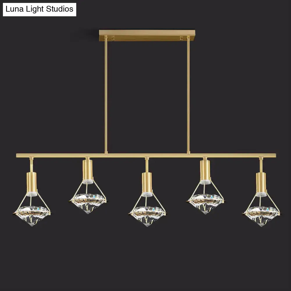 Modern gold finish light fixture with five crystal diamond-shaped shades for kitchen island lighting
