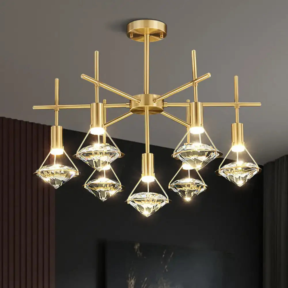 Modern gold finish light fixture with six crystal diamond-shaped shades on geometric frame for kitchen island