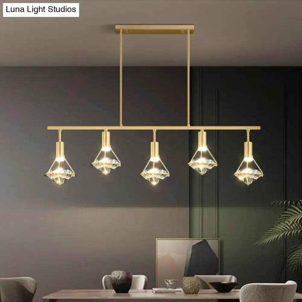 Modern gold finish light fixture with five crystal-encrusted glass shades for kitchen island lighting