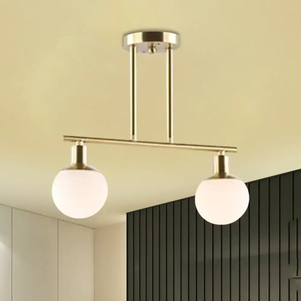 DecorBites™ modern linear chandelier with two milk glass globes and gold finish ceiling pendant light fixture