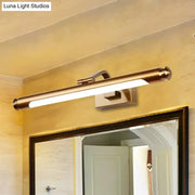 Brass-finished gold finish tubed led vanity light wall sconce with sleek rectangular design mounted above mirror