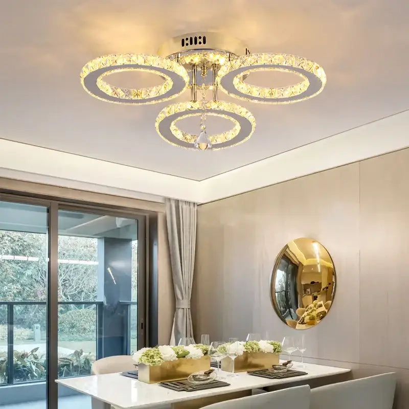 Modern gold five ring decorbites crystal ceiling chandelier with interlocking rings and clear faceted crystals