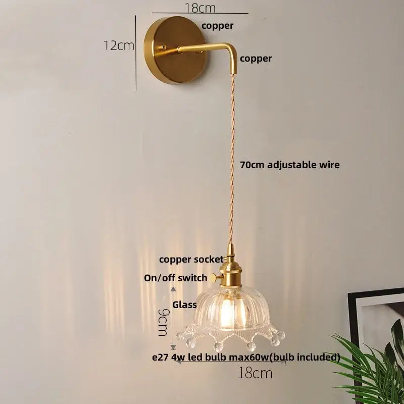 Modern gold fluted clear glass led wall light with brass-finished copper and petal-shaped shade decorbites clear glass wall light