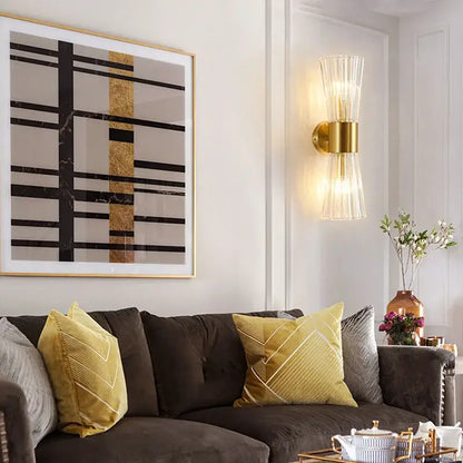 Modern gold fluted crystal wall sconce with ribbed glass shade and brass accents for elegant living room lighting decorbites crystal wall