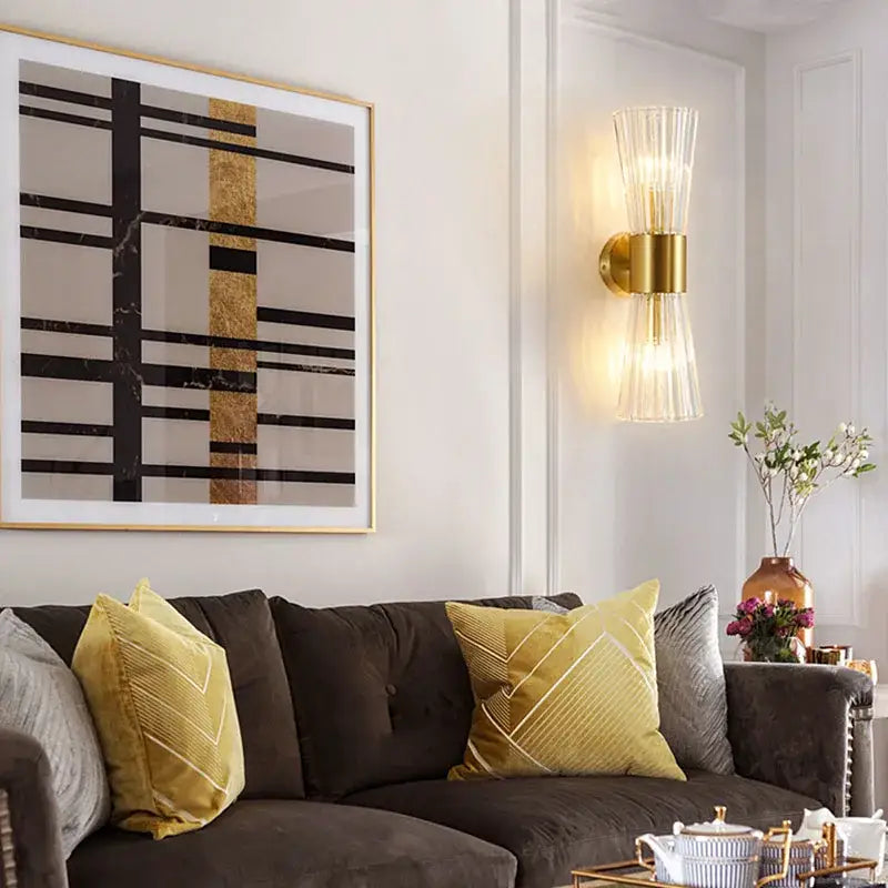 Modern gold fluted crystal wall sconce with ribbed glass shade and brass accents for elegant living room lighting decorbites crystal wall