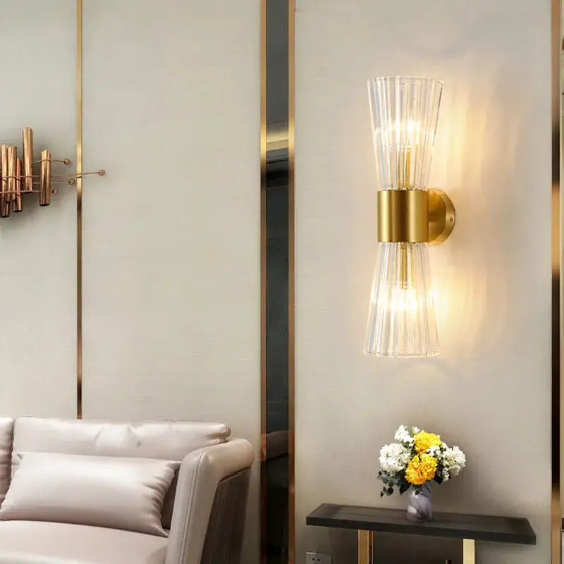 Modern gold fluted crystal wall sconce featuring gold-toned metal and clear glass shades for living room decorbites crystal wall lighting