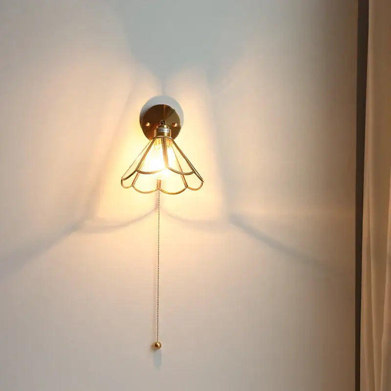 Modern gold-toned metal led wall sconce with petal-shaped cage design and pull chain for bedroom decorbites led wall use