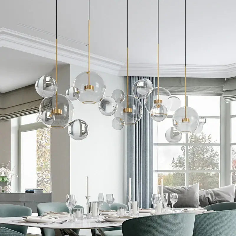 Modern gold frosted glass ball pendant light with frosted glass and metal accents for dining room illumination