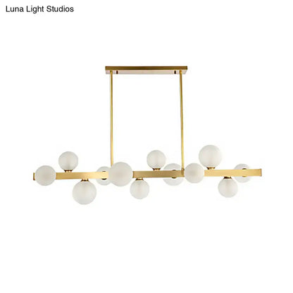 Modern gold frosted glass globe pendant light with chain cord length features linear bulbs for dining room island lighting