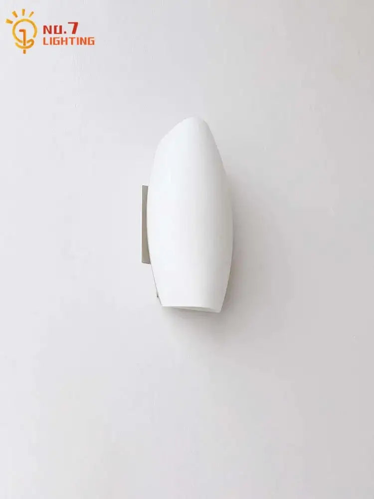 Modern gold frosted glass led wall lamp with white sleek acrylic diffuser and metallic bracket for bedroom lighting