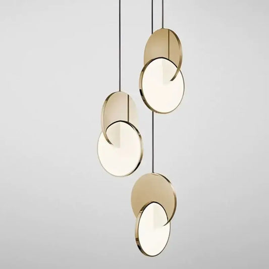 Modern gold geometric circle pendant light featuring overlapping disc design for dining room decorbites geometric circle