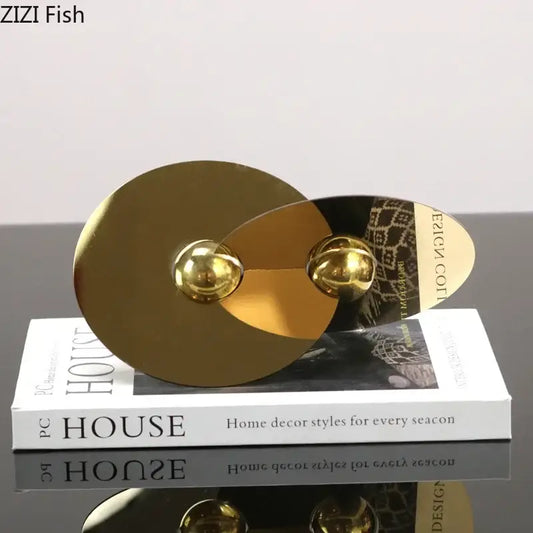 Modern gold geometric circle sculpture metal ornament featuring two overlapping discs with spherical accents for living room