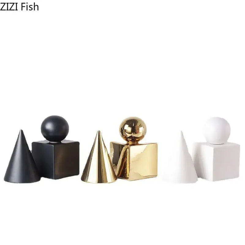 Set of three modern cube round statues featuring matte black, glossy gold, and white ceramic geometric decor pieces