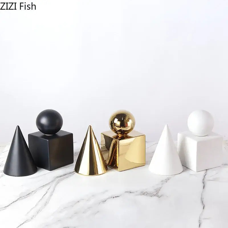 Set of modern gold geometric cube round statue decor featuring matte black, glossy gold, and white ceramic shapes with spherical tops