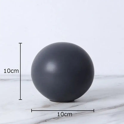 Modern gold geometric cube round statue decor featuring a sleek matte black 10cm diameter round statue sphere