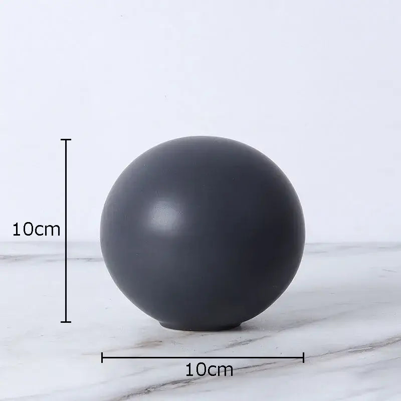 Modern gold geometric cube round statue decor featuring a sleek matte black 10cm diameter round statue sphere