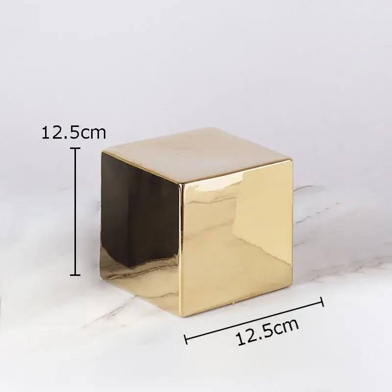 A sleek 12.5cm gold-plated ceramic cube round statue with glossy finish and sharp edges for modern living room decor