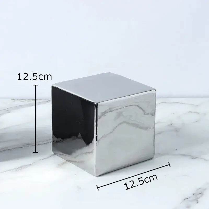 A sleek 12.5cm cube round statue planter in polished silver ceramic for modern living room decor
