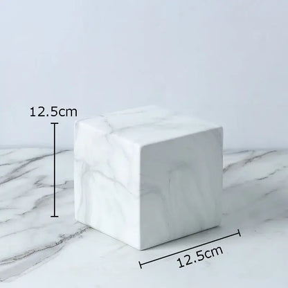 Modern gold geometric cube round statue decor featuring a white marble cube with gray veining measuring 12.5cm sides