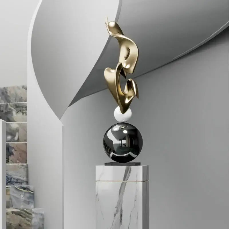 Modern gold geometric electroplating art sculpture with flowing forms on marble sphere and black orb for living room decor