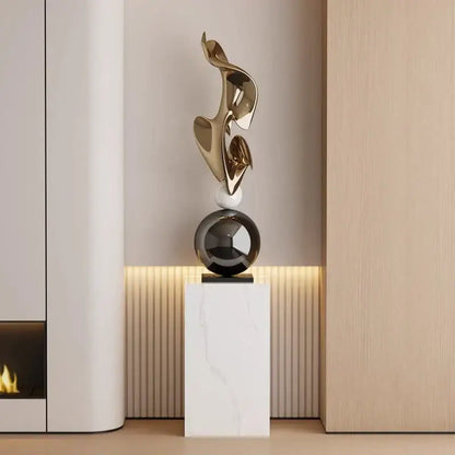 Modern gold geometric electroplating art sculpture with flowing curves on black spherical base for living room decor