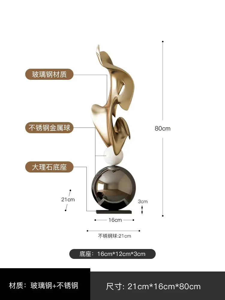 A modern gold geometric electroplating art sculpture with flowing glass steel forms on a stainless steel sphere base