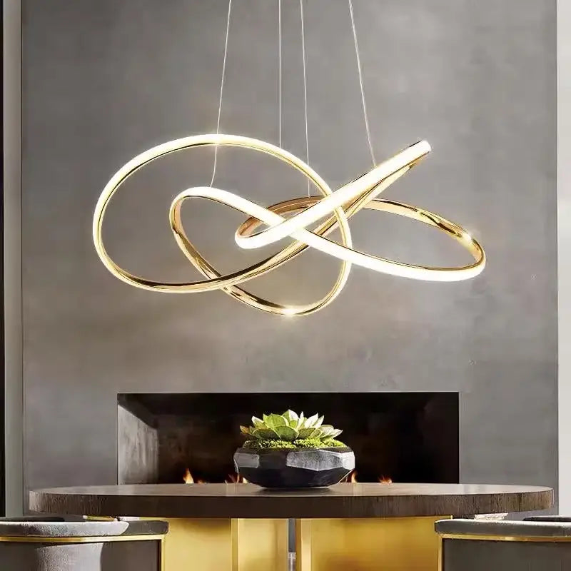 Modern gold geometric led ceiling pendant light with intertwined circular rings and sleek minimalist design by decorbites