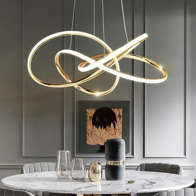 Modern gold-toned infinity loop pendant light with sleek design for dining room by decorbites geometric led ceiling