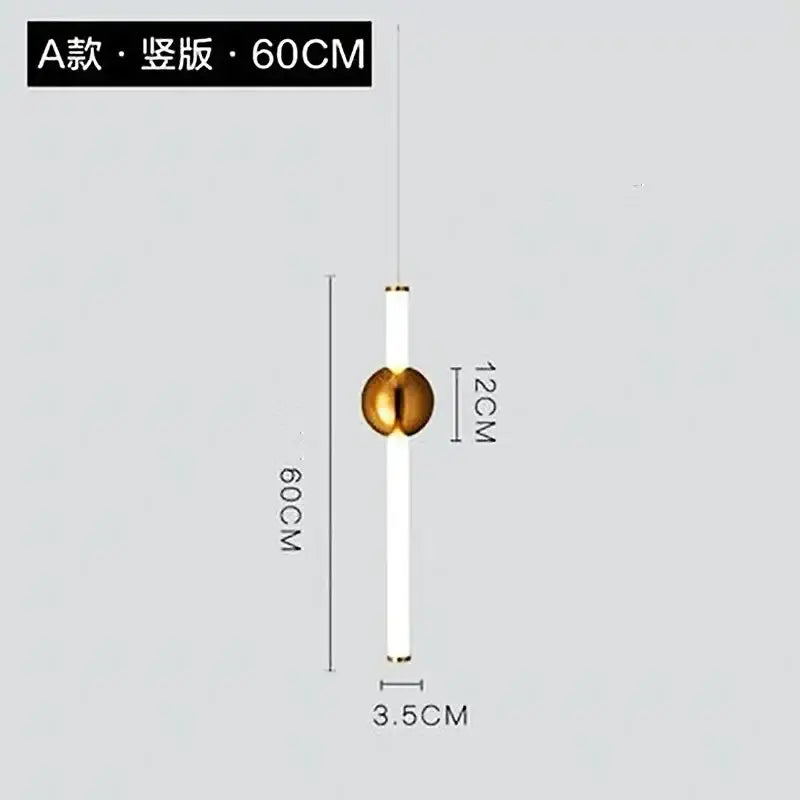 A modern pendant light with a white cylindrical body and gold spherical accent featuring a geometric line frame design
