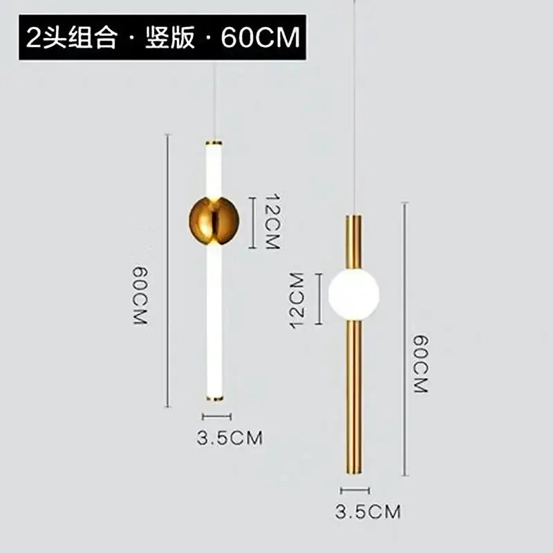 Modern gold geometric line frame pendant lights with sleek cylindrical bodies and white glass globe for dining room