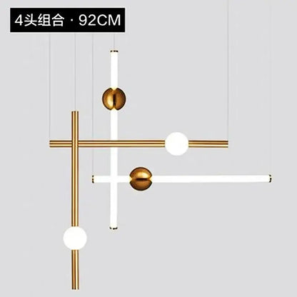 Modern gold geometric line frame pendant lights with gold metal rods and white cylindrical fixtures for dining room use